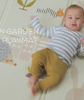 Baby playing on Taf Toys Urban Garden waterproof foam playmat