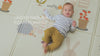 Baby playing on Taf Toys Urban Garden waterproof foam playmat